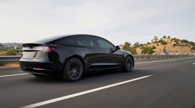Sleek Black Tesla Highway Drive